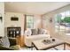 Cozy living room with stylish furniture, windows for natural light, and hardwood flooring at 3304 W 3Rd Ave, Denver, CO 80219