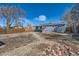 A spacious backyard with a covered patio and rock landscaping at 5295 Perry St, Denver, CO 80212