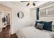 Bedroom featuring dark hardwood floors and soft lighting at 5295 Perry St, Denver, CO 80212