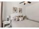 Bright bedroom with neutral tones and modern accents, including dark hardwood floors at 5295 Perry St, Denver, CO 80212