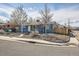 Exterior view of a charming single-story home on a corner lot near the sidewalk at 5295 Perry St, Denver, CO 80212