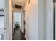Hallway with hardwood floors leading to bedroom and bathroom at 5295 Perry St, Denver, CO 80212