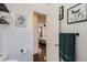 Hallway leading to a bedroom with dark wood floors and white trim at 5295 Perry St, Denver, CO 80212