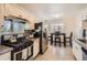 Well-equipped kitchen with modern appliances and a breakfast nook with seating at 5295 Perry St, Denver, CO 80212