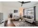 Comfortable living room with a cozy seating area, hardwood floors and natural light at 5295 Perry St, Denver, CO 80212