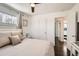 Main bedroom with a ceiling fan, and natural light at 5295 Perry St, Denver, CO 80212