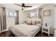 Bedroom with hardwood floors, natural light and comfortable neutral decor at 5295 Perry St, Denver, CO 80212