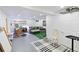 Basement featuring a painting area with a sofa, faux grass rug, art and recessed lighting at 12466 E Amherst Cir, Aurora, CO 80014