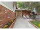 Welcoming front porch featuring a beautiful flower bed and two rocking chairs at 12466 E Amherst Cir, Aurora, CO 80014