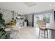Kitchen featuring a wine bar with cabinetry, wine fridge, and a sliding door to outdoor deck at 12466 E Amherst Cir, Aurora, CO 80014