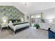 Spacious main bedroom with patterned wallpaper, slider door, and plush carpeting at 12466 E Amherst Cir, Aurora, CO 80014