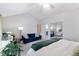 Bright main bedroom with a slider door, plush carpeting, and ample natural light at 12466 E Amherst Cir, Aurora, CO 80014