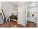 Open dining area flows into the kitchen, featuring a modern chandelier and ample seating at 13040 W 63Rd Pl # A, Arvada, CO 80004