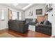 Bright and airy living room features vaulted ceilings, skylights and a cozy brick fireplace at 13040 W 63Rd Pl # A, Arvada, CO 80004