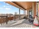 Spacious back deck with seating provides a relaxing outdoor space for enjoying the scenic views at 6592 Club Villa Rd, Parker, CO 80134