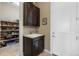 Mud room featuring sink, cabinets and access to pantry at 6592 Club Villa Rd, Parker, CO 80134