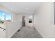 Carpeted loft space with natural light and access to balcony at 2259 Kipling St, Lakewood, CO 80215