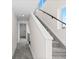 Bright staircase with modern railing and plush carpet at 2259 Kipling St, Lakewood, CO 80215