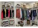 Well-organized walk-in closet with shelving, hanging rods, and shoe storage at 1438 Little Raven St # 306, Denver, CO 80202