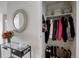 Entry closet with rod and shelf for coats and bags at 1438 Little Raven St # 306, Denver, CO 80202