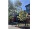 Well-maintained condo building featuring lush trees and landscaping at 1438 Little Raven St # 306, Denver, CO 80202