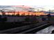 Evening view of the riverwalk featuring pathways, bridges, and colorful sky at sunset at 1438 Little Raven St # 306, Denver, CO 80202