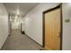 Well-lit hallway with neutral tones, leading to unit 306 and other residential spaces at 1438 Little Raven St # 306, Denver, CO 80202