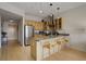 Modern kitchen featuring stainless steel appliances and a breakfast bar at 1438 Little Raven St # 306, Denver, CO 80202