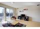 Inviting living room with natural light, comfortable chair, and access to a balcony at 1438 Little Raven St # 306, Denver, CO 80202