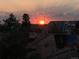 Sunset view of the city showing nearby pedestrian bridge and the river at 1438 Little Raven St # 306, Denver, CO 80202