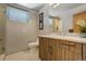 Modern bathroom with double vanity and tiled shower at 5401 Antler Run, Littleton, CO 80125