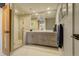 Modern bathroom with double vanity and glass shower at 5401 Antler Run, Littleton, CO 80125