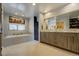 Elegant bathroom with double vanity, soaking tub, and walk-in shower at 5401 Antler Run, Littleton, CO 80125