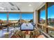 Modern dining area with panoramic windows and stunning views at 5401 Antler Run, Littleton, CO 80125