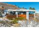 Contemporary home with wood siding and expansive windows at 5401 Antler Run, Littleton, CO 80125