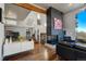 Modern living room features a fireplace and hardwood floors at 5401 Antler Run, Littleton, CO 80125