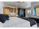 Main bedroom with fireplace and mountain views at 5401 Antler Run, Littleton, CO 80125