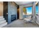 Main bedroom sitting area with fireplace and view at 5401 Antler Run, Littleton, CO 80125