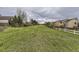 Overlooking a lush green yard, lined with fences, offering a serene outdoor experience at 10987 Cannonade Dr, Parker, CO 80138