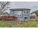 Exterior backyard view showcasing lush lawn and deck area, ideal for relaxing or entertaining at 10987 Cannonade Dr, Parker, CO 80138