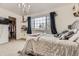 Cozy bedroom features a large window with curtains and a view outside and closet at 10987 Cannonade Dr, Parker, CO 80138