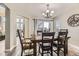 Elegant dining room with a chandelier and ample natural light at 10987 Cannonade Dr, Parker, CO 80138