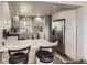 Spacious kitchen with a breakfast bar and stainless steel appliances at 10987 Cannonade Dr, Parker, CO 80138