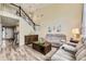 Bright living room featuring vaulted ceilings, rustic wood accents, and comfortable, reclining sofas at 10987 Cannonade Dr, Parker, CO 80138