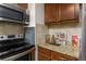 Kitchen with stainless steel appliances and granite countertops at 5235 Quay St, Arvada, CO 80002