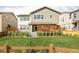 View of the home's backyard, showcasing the lush grass, and wood fence at 740 Meadowlark Dr, Erie, CO 80516