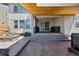 Spacious backyard patio featuring a hot tub, built-in grill, and stylish outdoor seating at 740 Meadowlark Dr, Erie, CO 80516