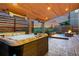 Inviting outdoor space with a hot tub, cozy fireplace, and stylish patio furniture for ultimate relaxation at 740 Meadowlark Dr, Erie, CO 80516