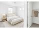 Inviting bedroom with neutral decor, a plush bed, and a closet for storage at 740 Meadowlark Dr, Erie, CO 80516