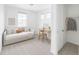 Cozy bedroom featuring daybed, desk, closet, and plenty of natural light at 740 Meadowlark Dr, Erie, CO 80516